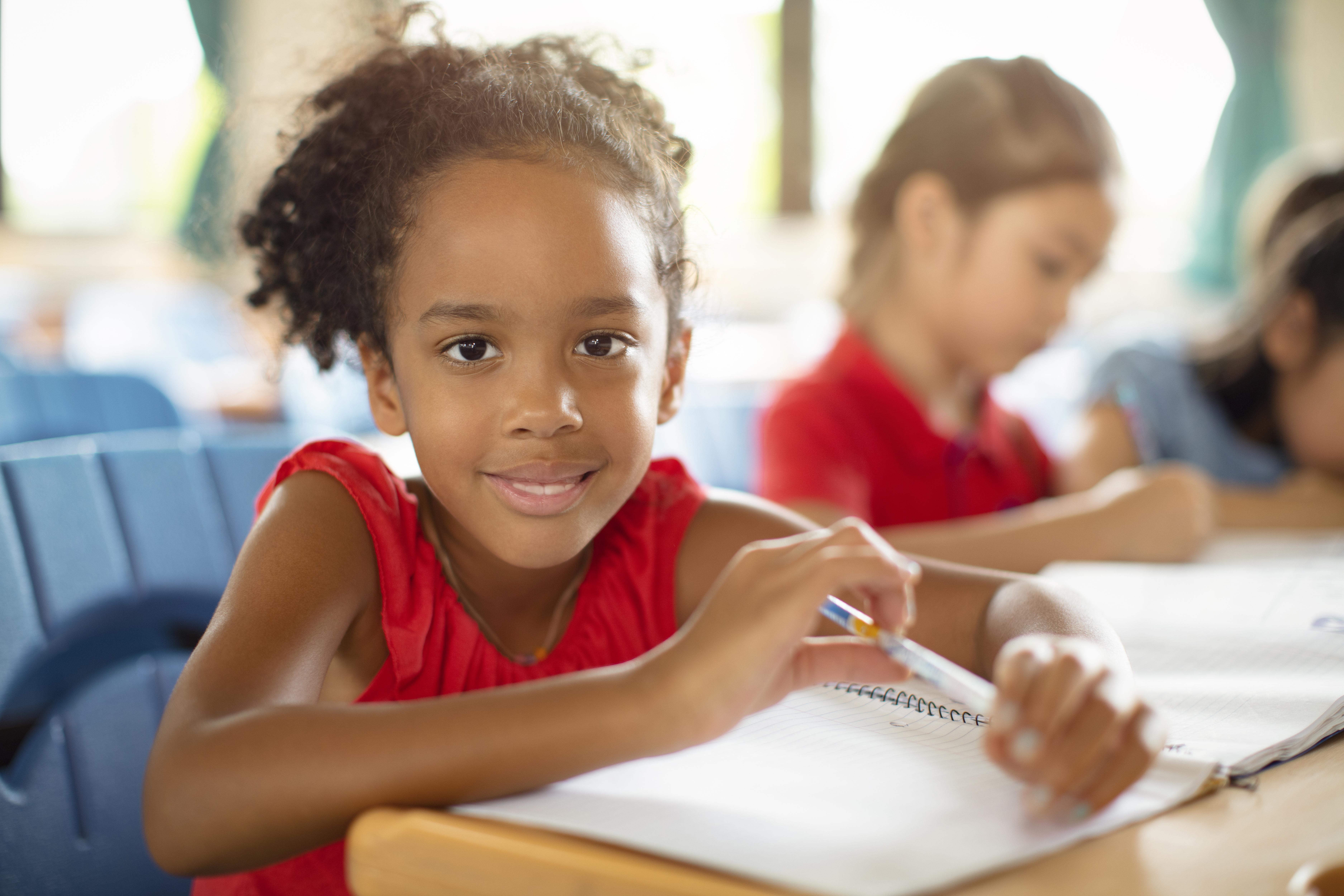 Smiling elementary school kids  in classroom