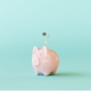Pink piggy bank with coins on pastel blue background. 3d rendering.jpg