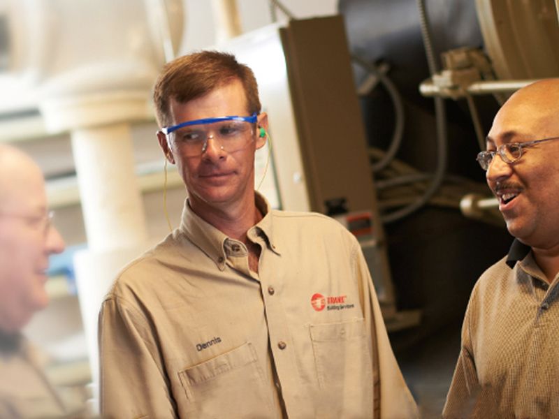 Customers_with_technicians_OneUp.jpg