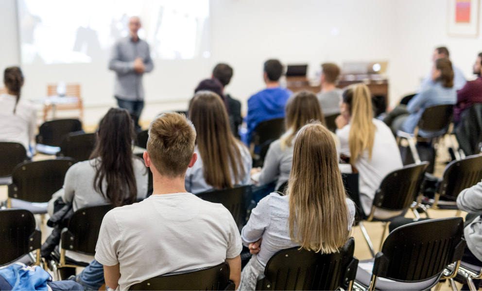 Students sitting in a lecture classroom